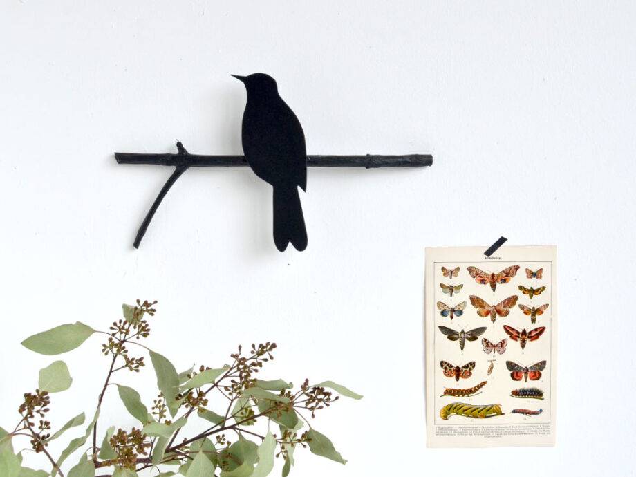 Renna Deluxe Amsel in Fraktur auf dem Ast im Angebot
